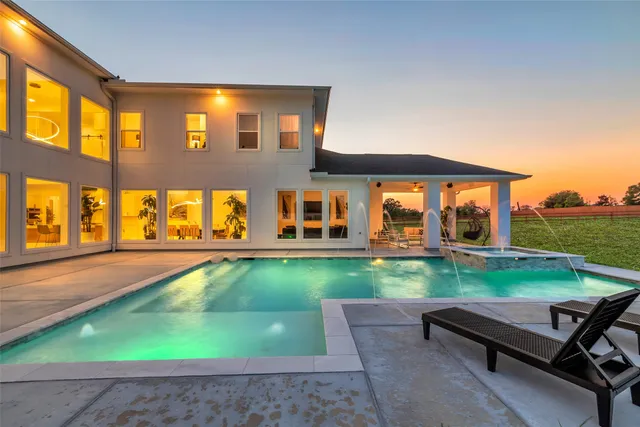 a backyard of a house with yard and outdoor seating