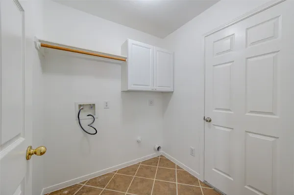a view of a storage & utility room with racks on the wall