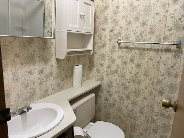 5885 Ramsey Road Millington, TN 38053 - Photo 11 of 11 a bathroom with a sink a toilet and a mirror