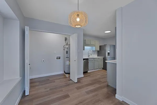 a kitchen with a refrigerator and a sink