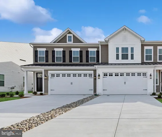 a front view of a house with a garage