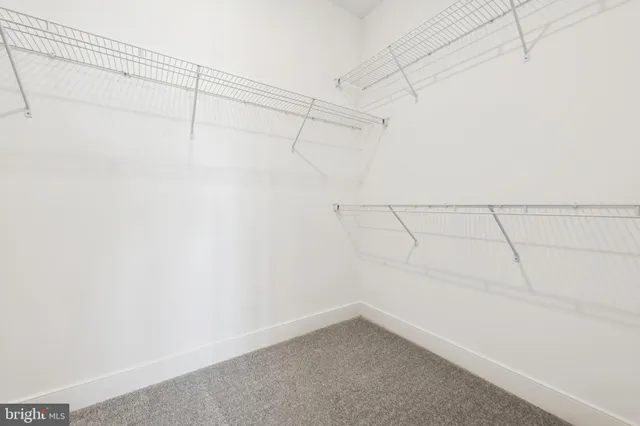 a view of a room with racks on the wall