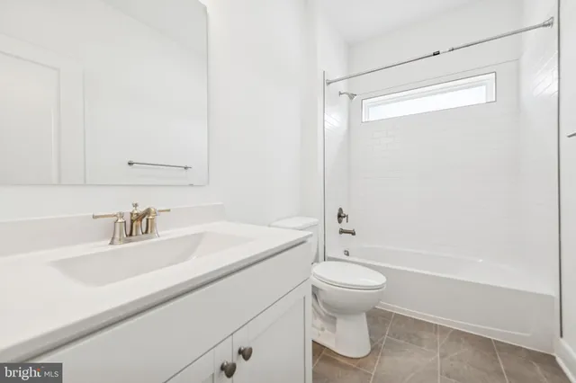 a bathroom with a sink a toilet and a bathtub
