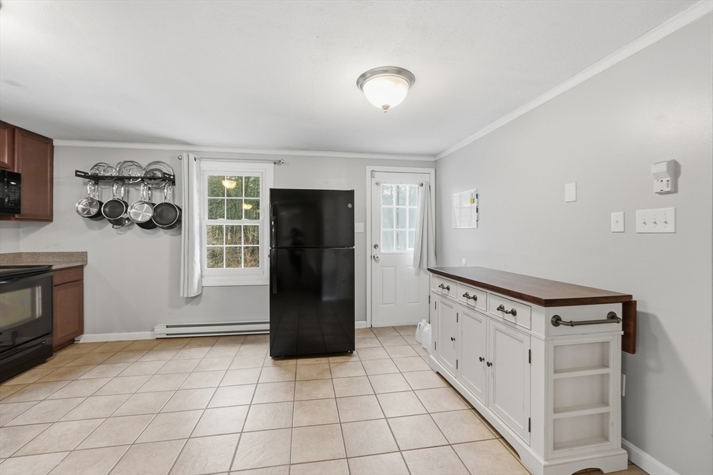 117 Draper Road East Brookfield, MA 01515 - Photo 11 of 27 a kitchen with granite countertop a refrigerator and a stove