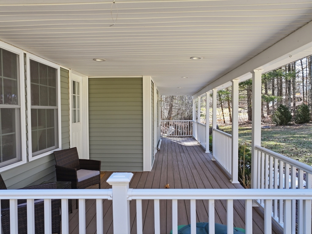 117 Draper Road East Brookfield, MA 01515 - Photo 5 of 27 a view of a deck with wooden floor and wooden fence