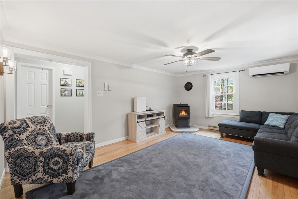 117 Draper Road East Brookfield, MA 01515 - Photo 9 of 27 a living room with furniture and a fireplace