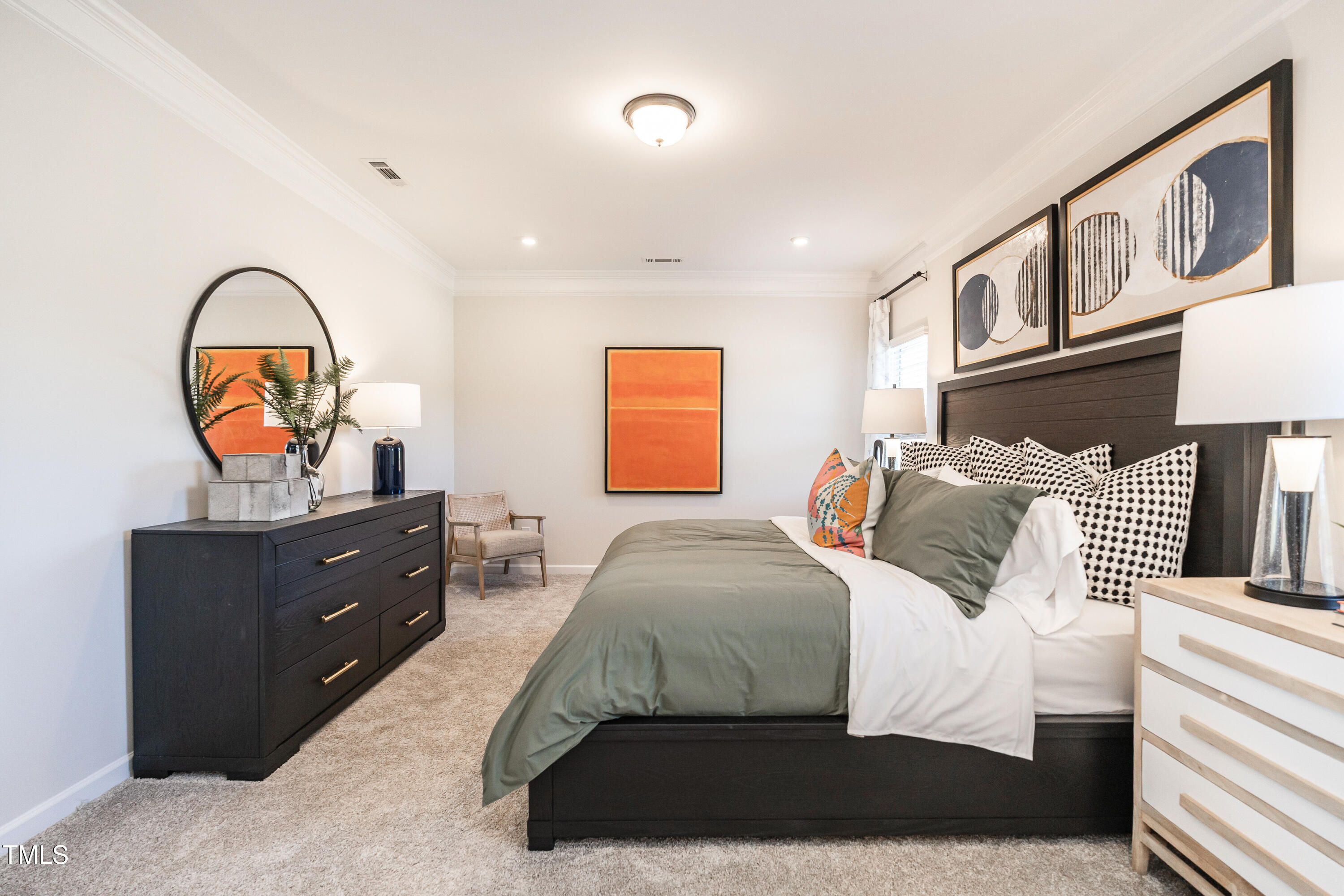 275 Deodora Lane Cameron, NC 28326 - Photo 27 of 38 a bedroom with a bed and a chandelier