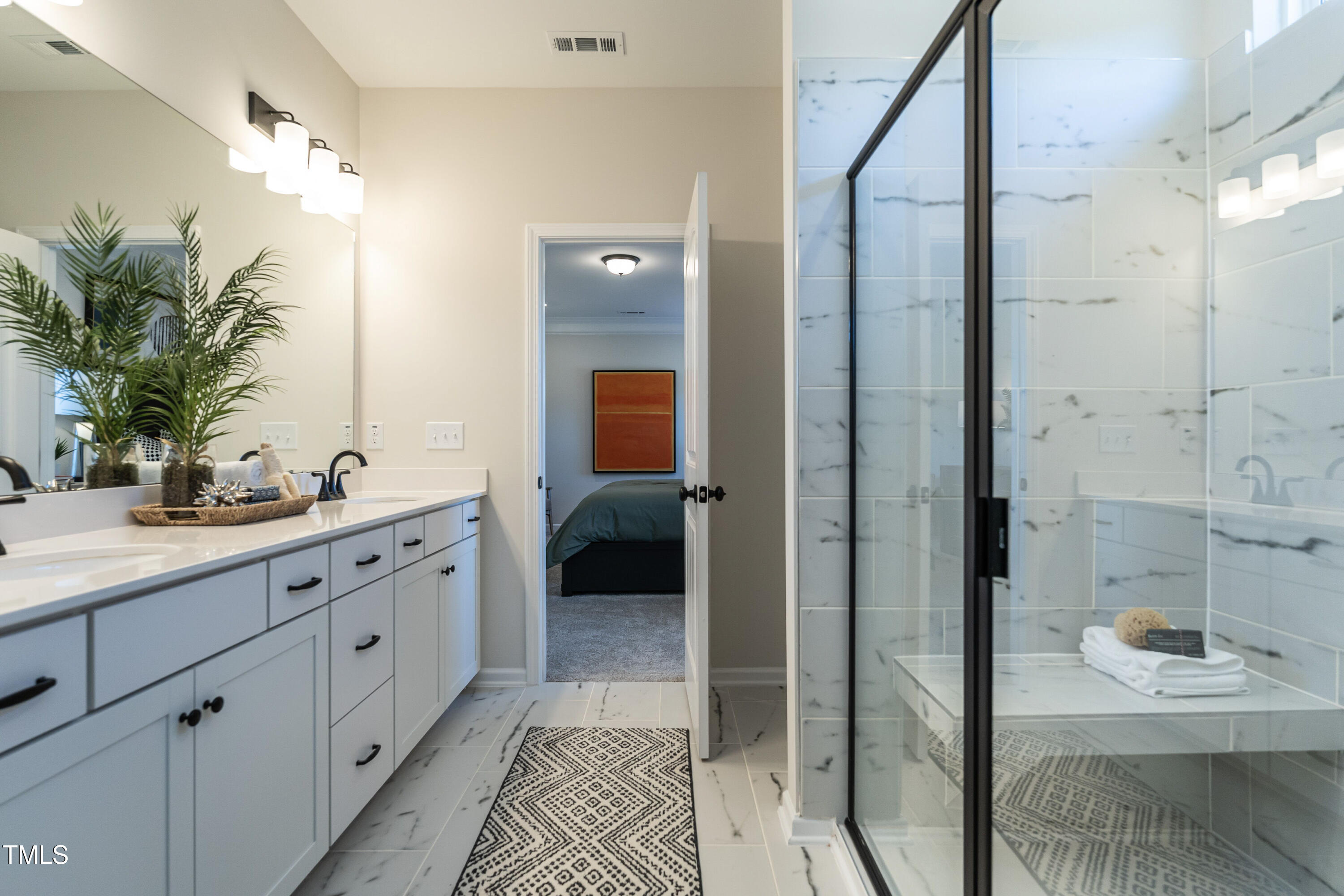 275 Deodora Lane Cameron, NC 28326 - Photo 29 of 38 a spacious bathroom with a double vanity sink a mirror and shower