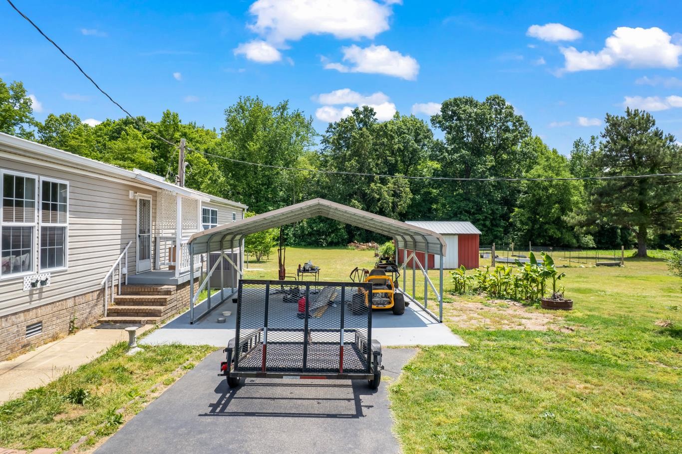 6439 Cedar Grove Road Big Sandy, TN 38221 - Photo 22 of 38 a view of a house with pool and chairs