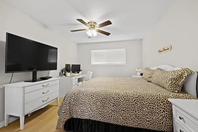 a room with a chair and a flat screen tv