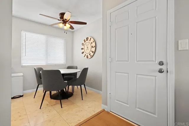 a living room with furniture window and a flat screen tv