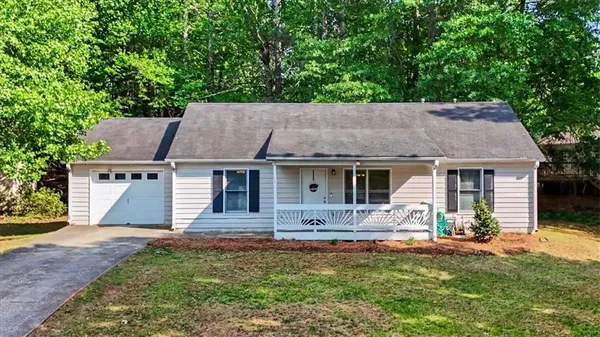 front view of a house with a yard