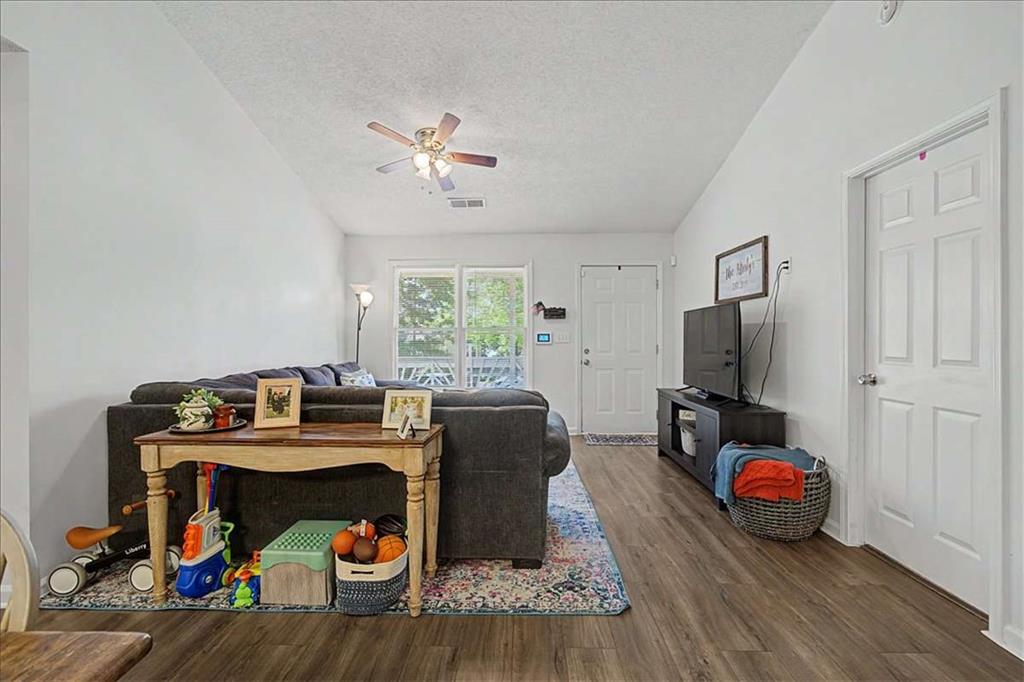 94 Villa Rosa Way Temple, GA 30179 - Photo 12 of 34 a living room with furniture and a flat screen tv