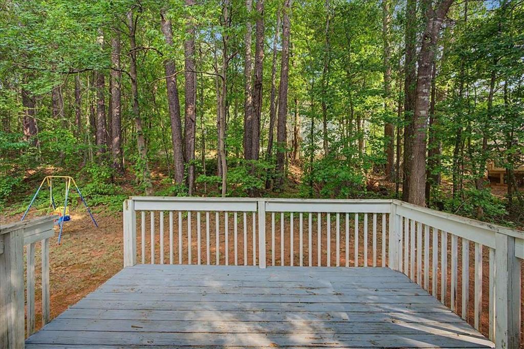 94 Villa Rosa Way Temple, GA 30179 - Photo 25 of 34 a balcony with wooden floor and fence