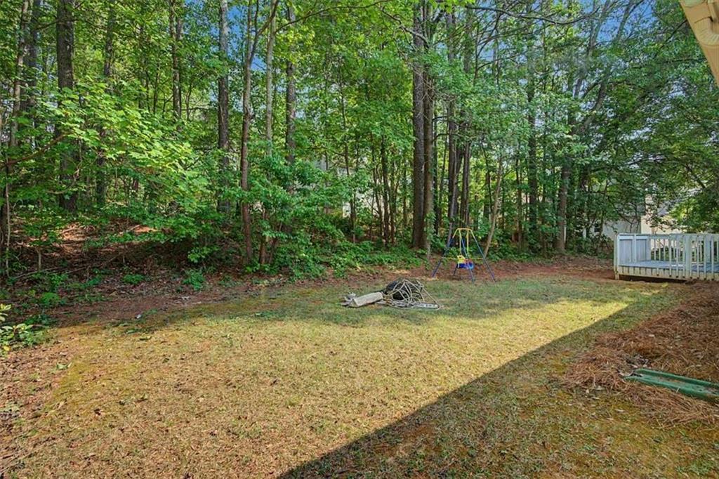 94 Villa Rosa Way Temple, GA 30179 - Photo 26 of 34 a view of a backyard with large trees