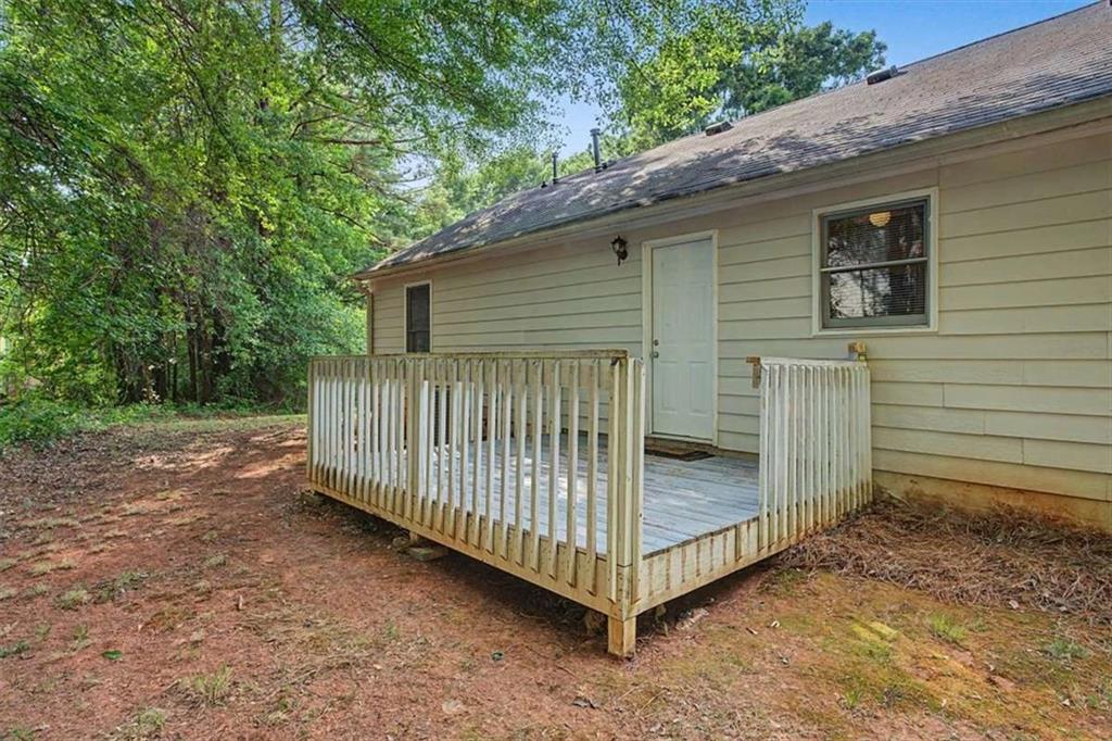 94 Villa Rosa Way Temple, GA 30179 - Photo 28 of 34 a view of a house with a backyard and wooden fence