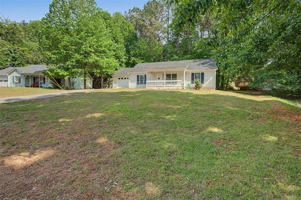 94 Villa Rosa Way Temple, GA 30179 - Photo 3 of 34 a front view of a house with a garden
