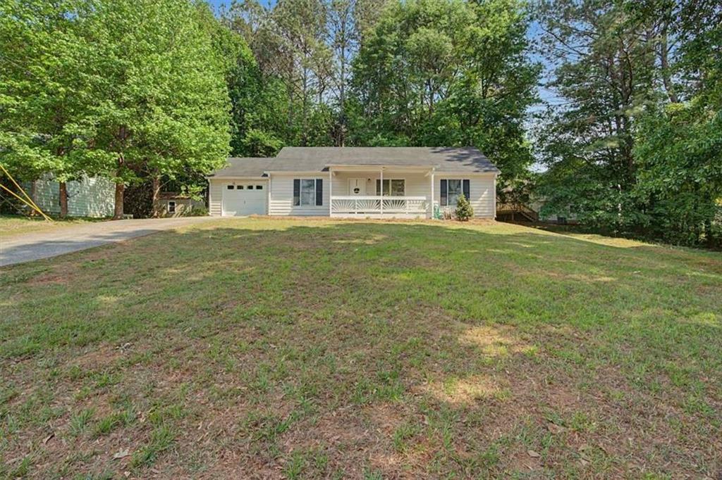 94 Villa Rosa Way Temple, GA 30179 - Photo 4 of 34 a front view of a house with a garden