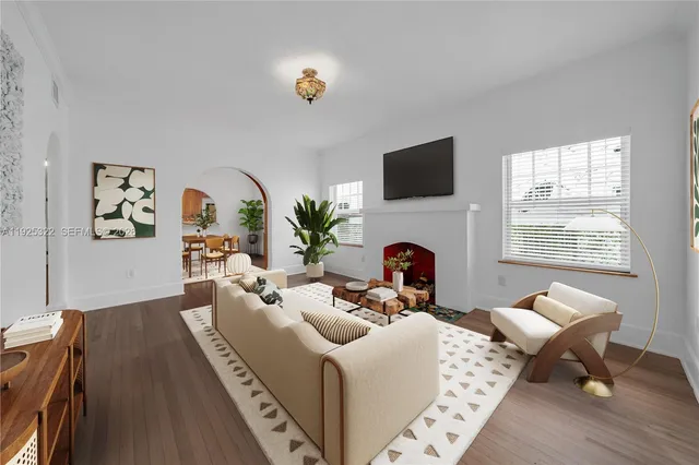 a living room with furniture fireplace and a flat screen tv