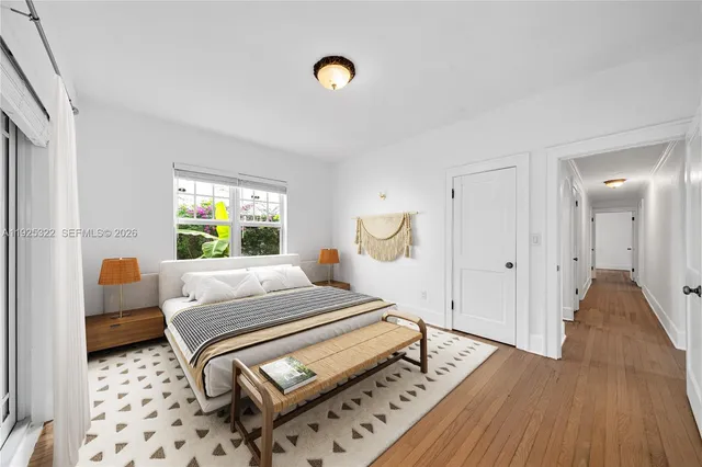 a bedroom with furniture and a window