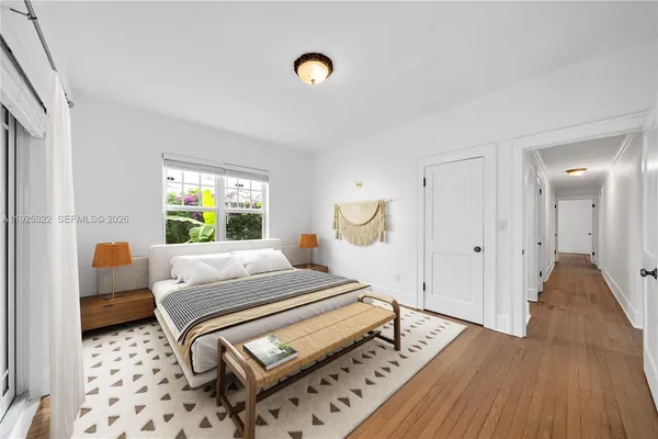 a bedroom with furniture and a window