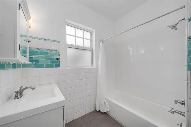 a bathroom with a sink and a bathtub