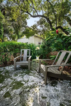 a view of a bench in a backyard