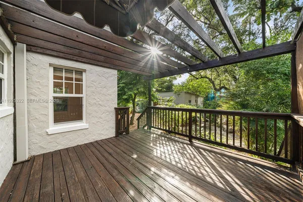 a view of porch with wooden floor