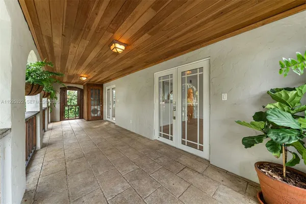 a view of an entryway with a flower pot