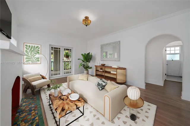 a living room with furniture and flat screen tv