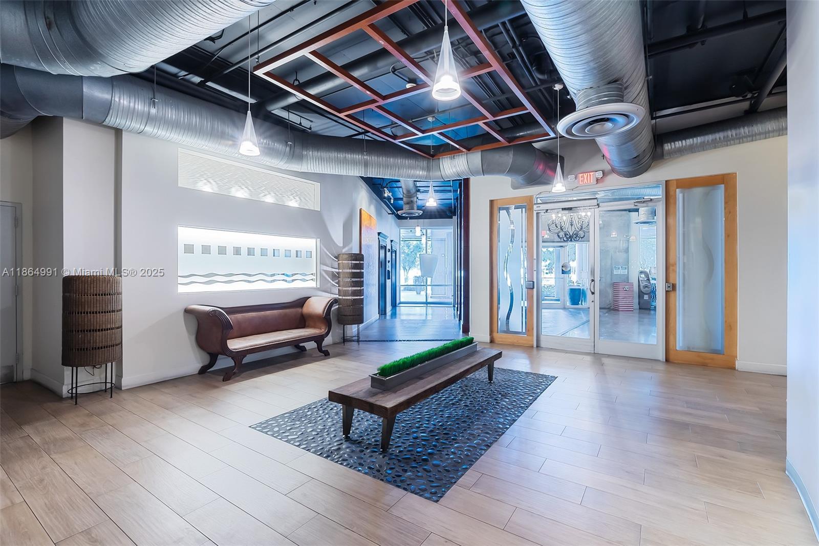 Riverside Miami, FL 33130 - Photo 14 of 20 a living room with furniture a wooden floor and a ceiling fan