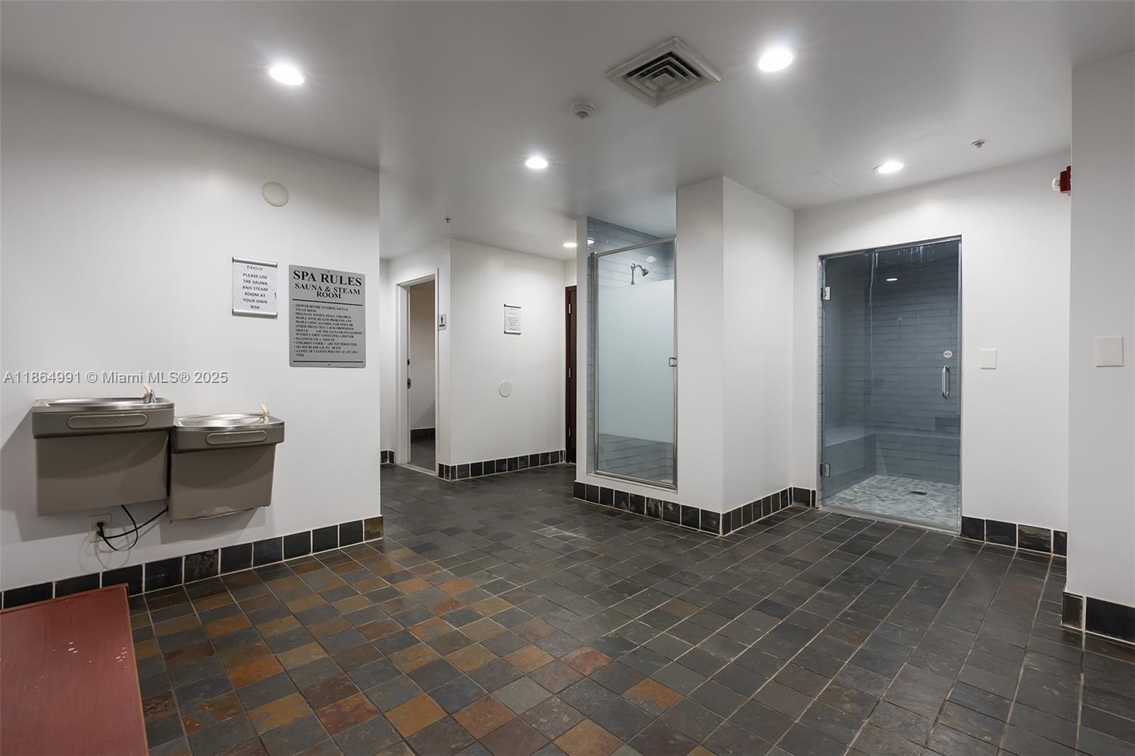 Riverside Miami, FL 33130 - Photo 15 of 20 an empty room with wooden floor and bathroom