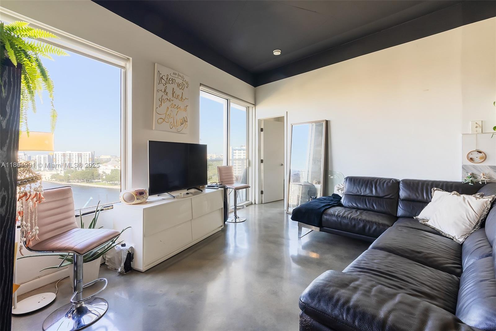 Riverside Miami, FL 33130 - Photo 2 of 20 a living room with furniture and a flat screen tv