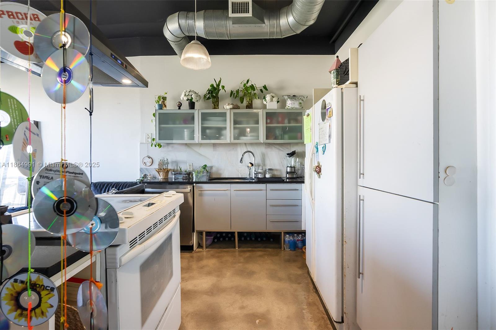 Riverside Miami, FL 33130 - Photo 3 of 20 a kitchen with stainless steel appliances granite countertop a refrigerator and a stove