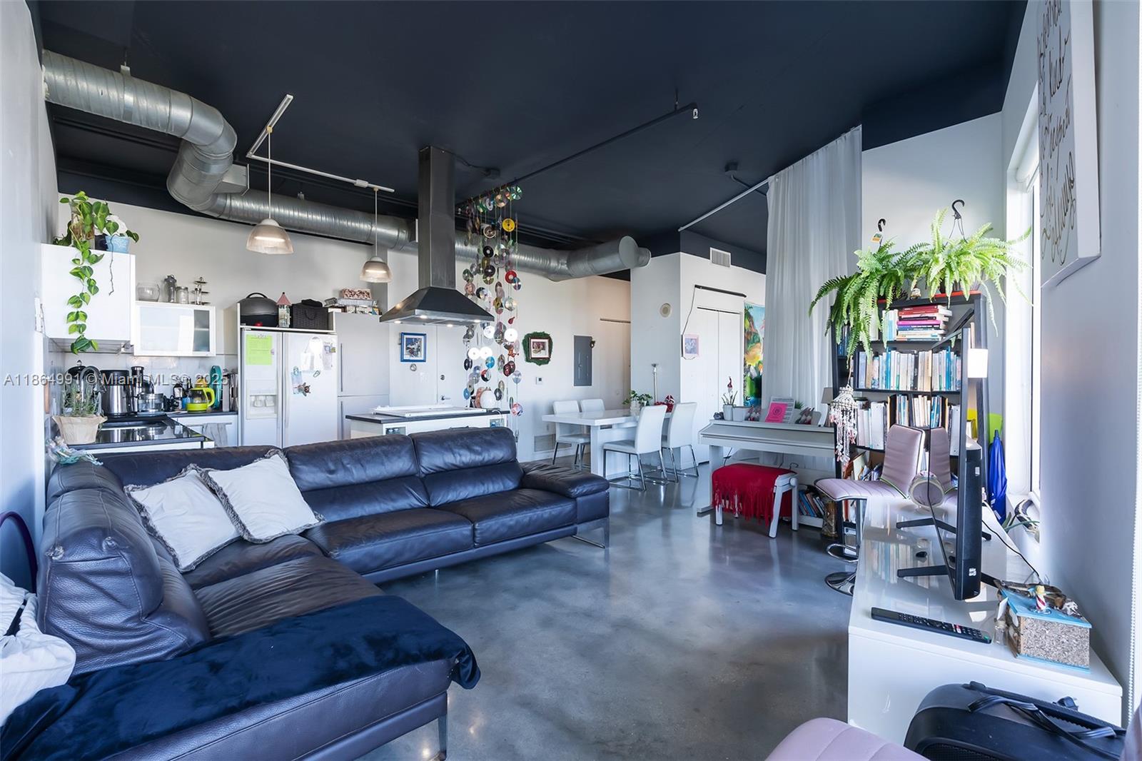 Riverside Miami, FL 33130 - Photo 4 of 20 a living room with furniture or chandelier and a wooden floor