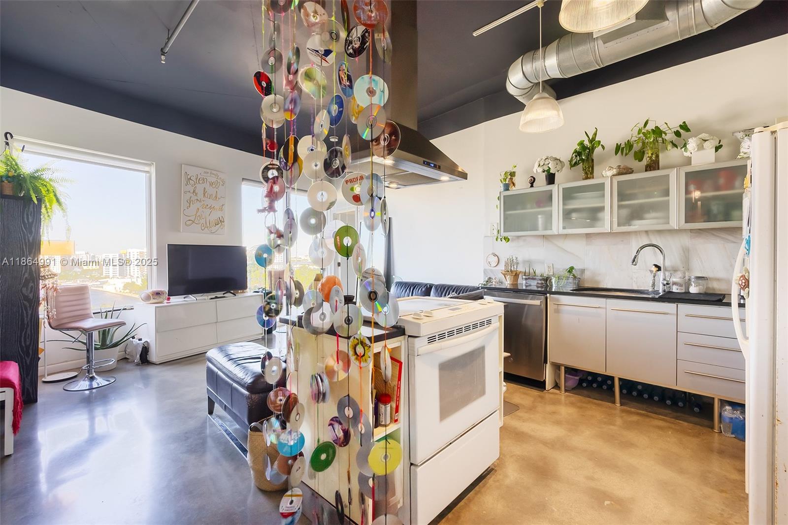 Riverside Miami, FL 33130 - Photo 5 of 20 a living room with granite countertop furniture and a flat screen tv