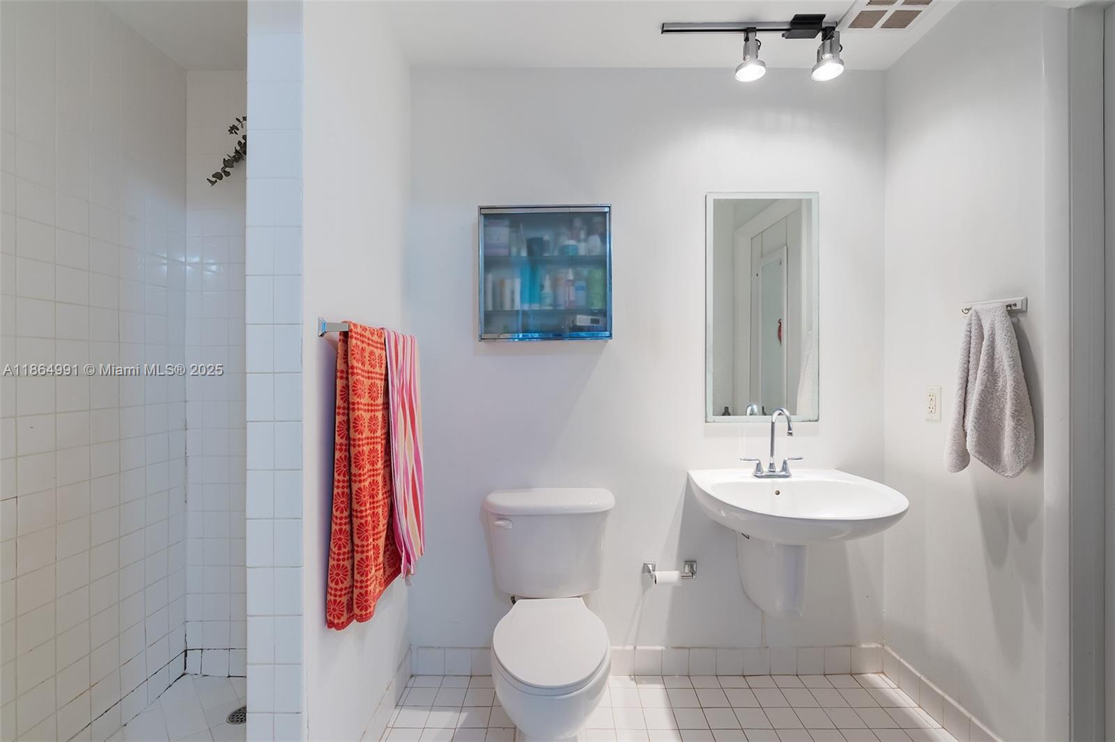 Riverside Miami, FL 33130 - Photo 10 of 20 a bathroom with a toilet sink and shower