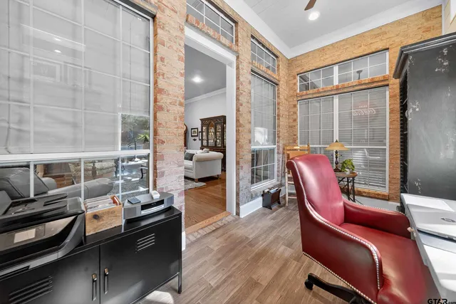 a view of a workspace with furniture and lounge chair