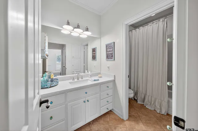 a bathroom with a double vanity sink and mirror