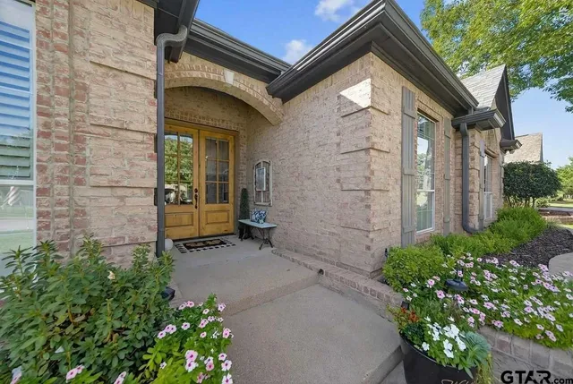a view of a small house with a small garden