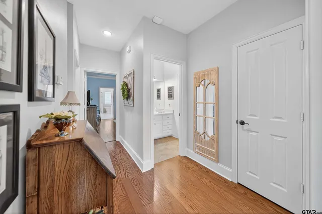 a view of a livingroom with wooden floor and a cabinet