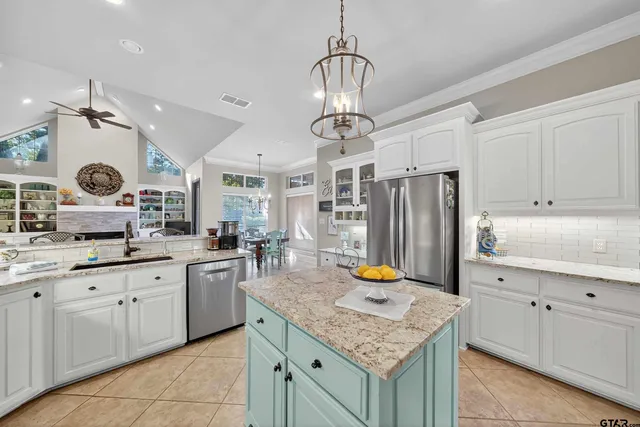a kitchen with stainless steel appliances granite countertop a sink counter space cabinets and counter space