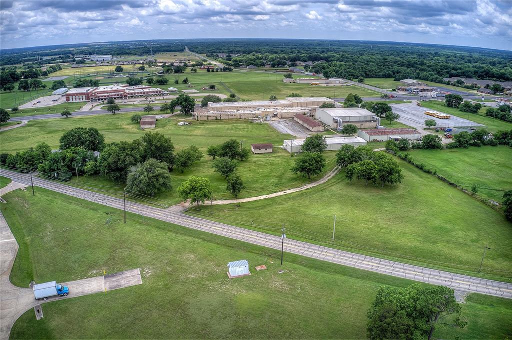 221 Maple Street Commerce, TX 75428 - Photo 8 of 19 an aerial view of a golf course with a garden