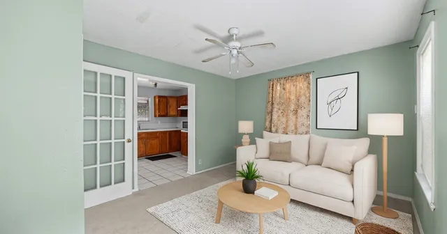 a living room with furniture and a rug