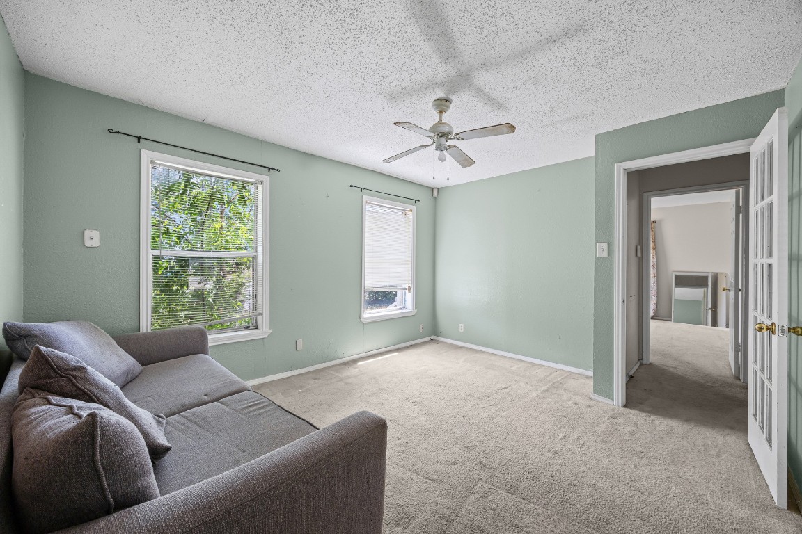 908 Vargas Road Austin, TX 78741 - Photo 13 of 28 a living room with furniture and a window