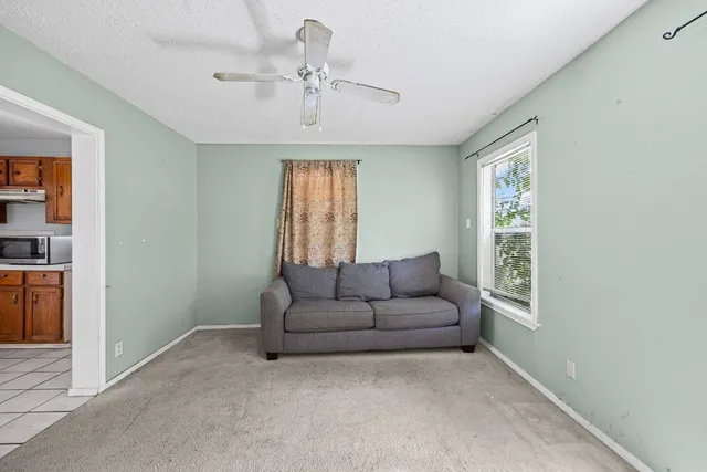 a living room with furniture and a window