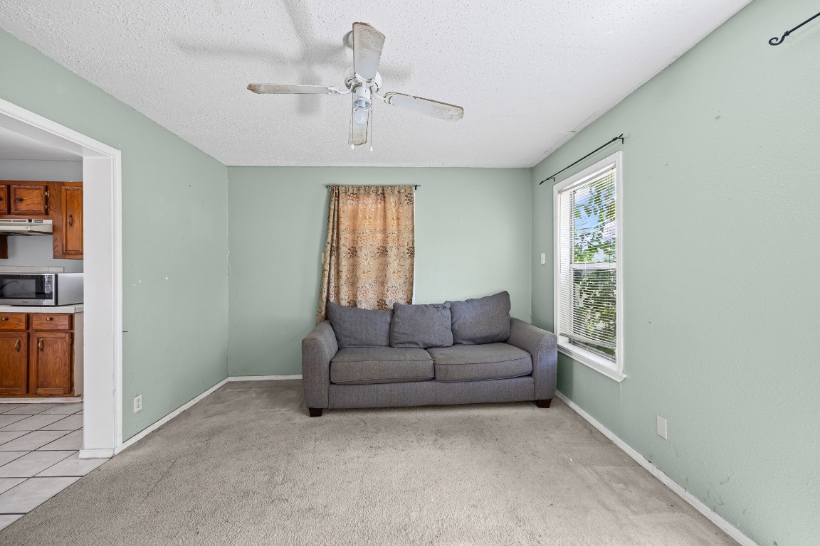 908 Vargas Road Austin, TX 78741 - Photo 14 of 28 a living room with furniture and a window