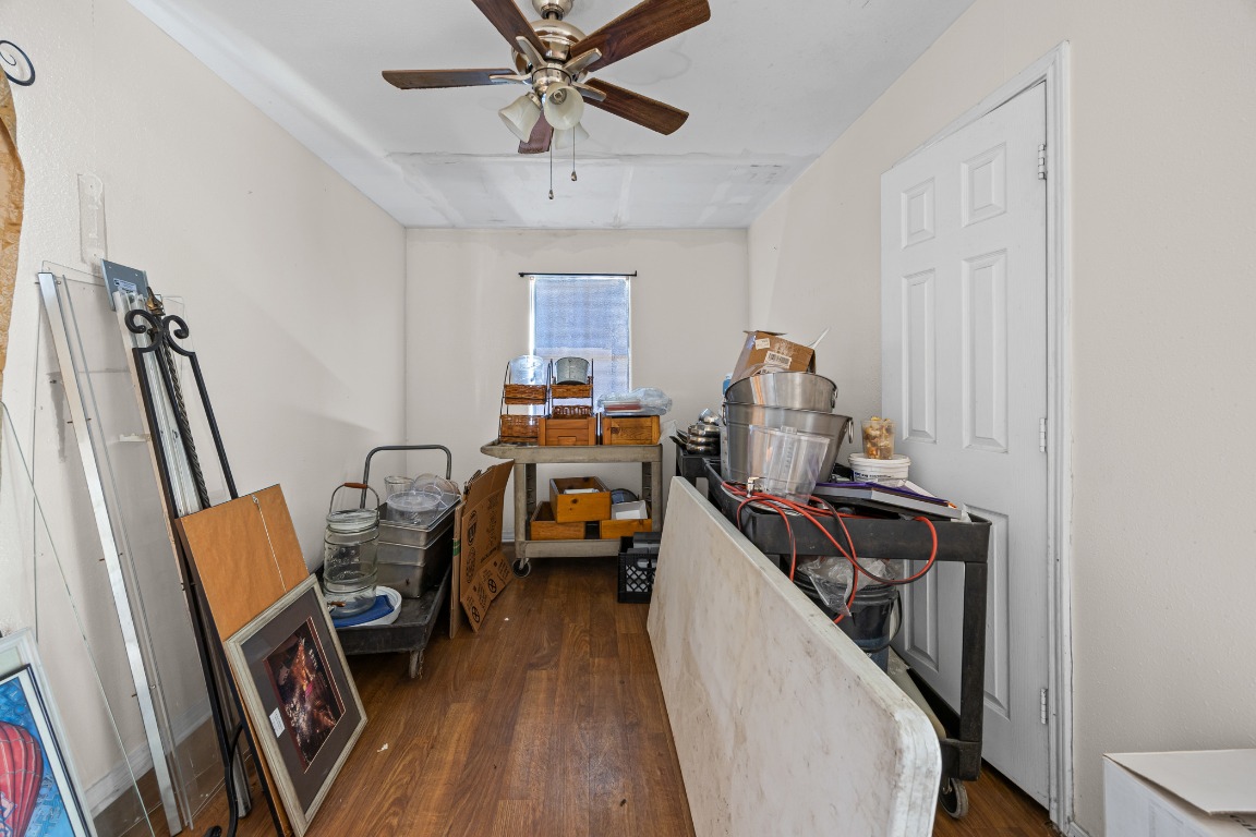 908 Vargas Road Austin, TX 78741 - Photo 18 of 28 a view of a workspace with furniture and a window