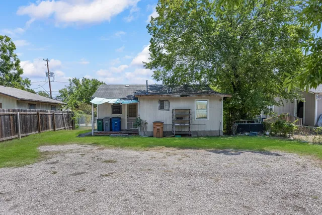 a view of a park with large trees