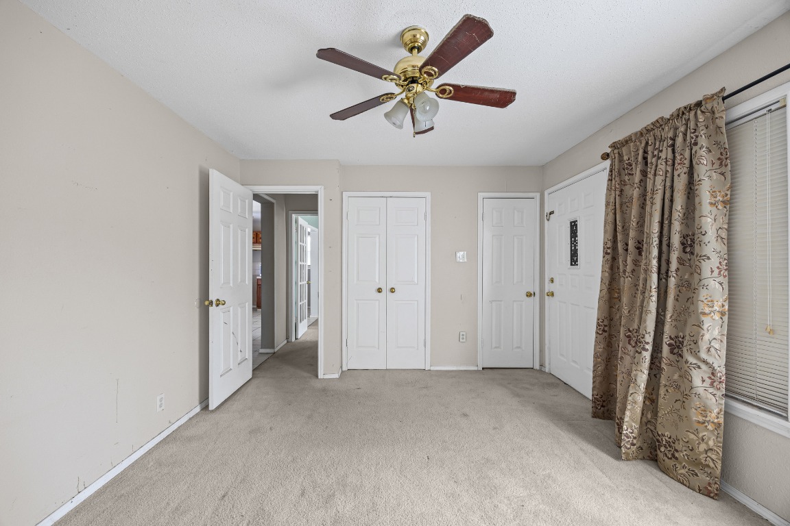 908 Vargas Road Austin, TX 78741 - Photo 9 of 28 a view of an empty room with a ceiling fan